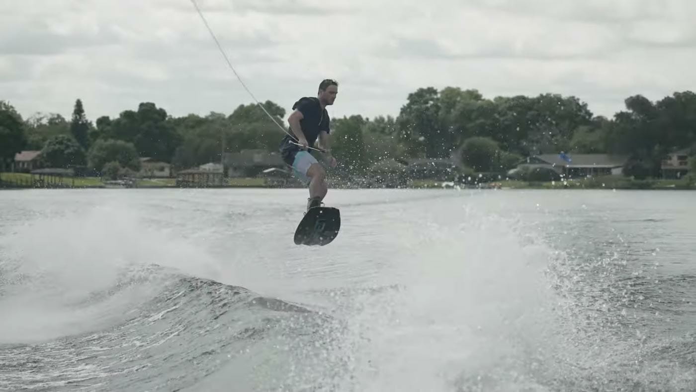 A man wakeboarding on a lake.