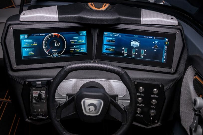 The dashboard and steering wheel of a sports car.
