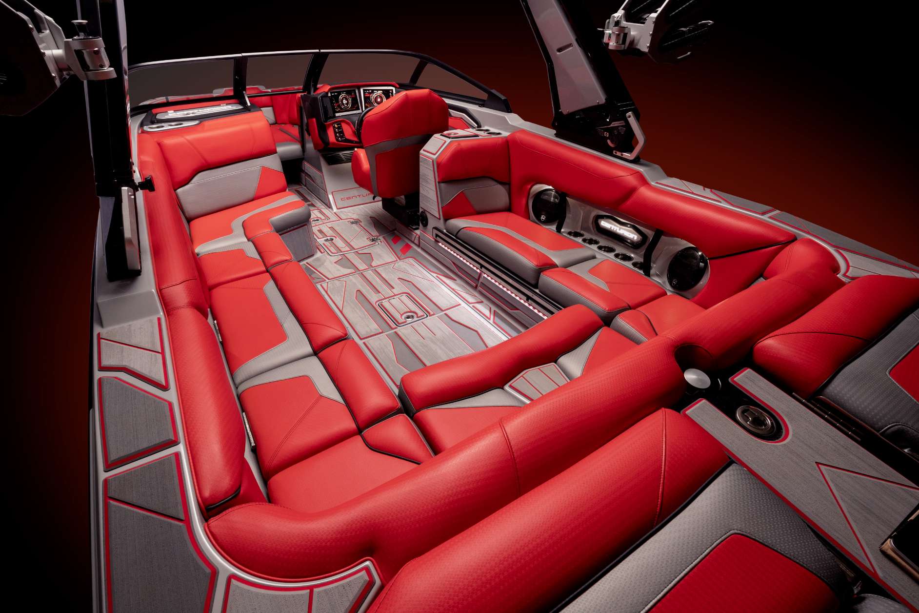 The interior of a red wakesurf boat.