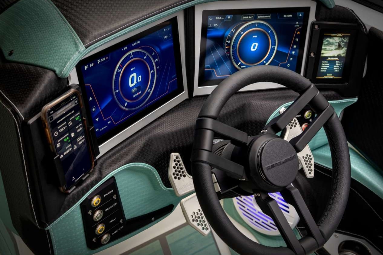 The interior of a futuristic car with monitors.