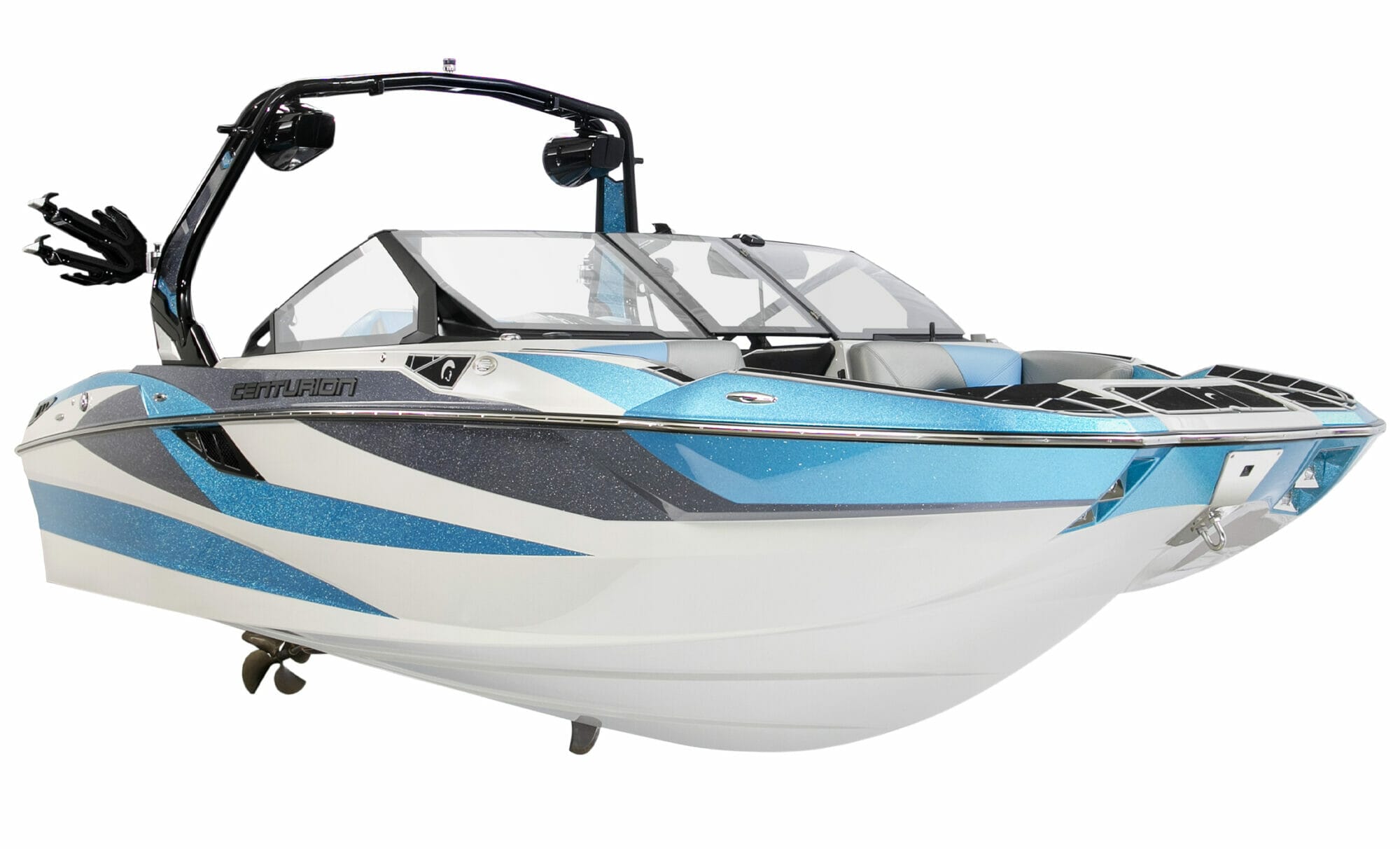 A blue and white wakeboat with a motor attached to it.