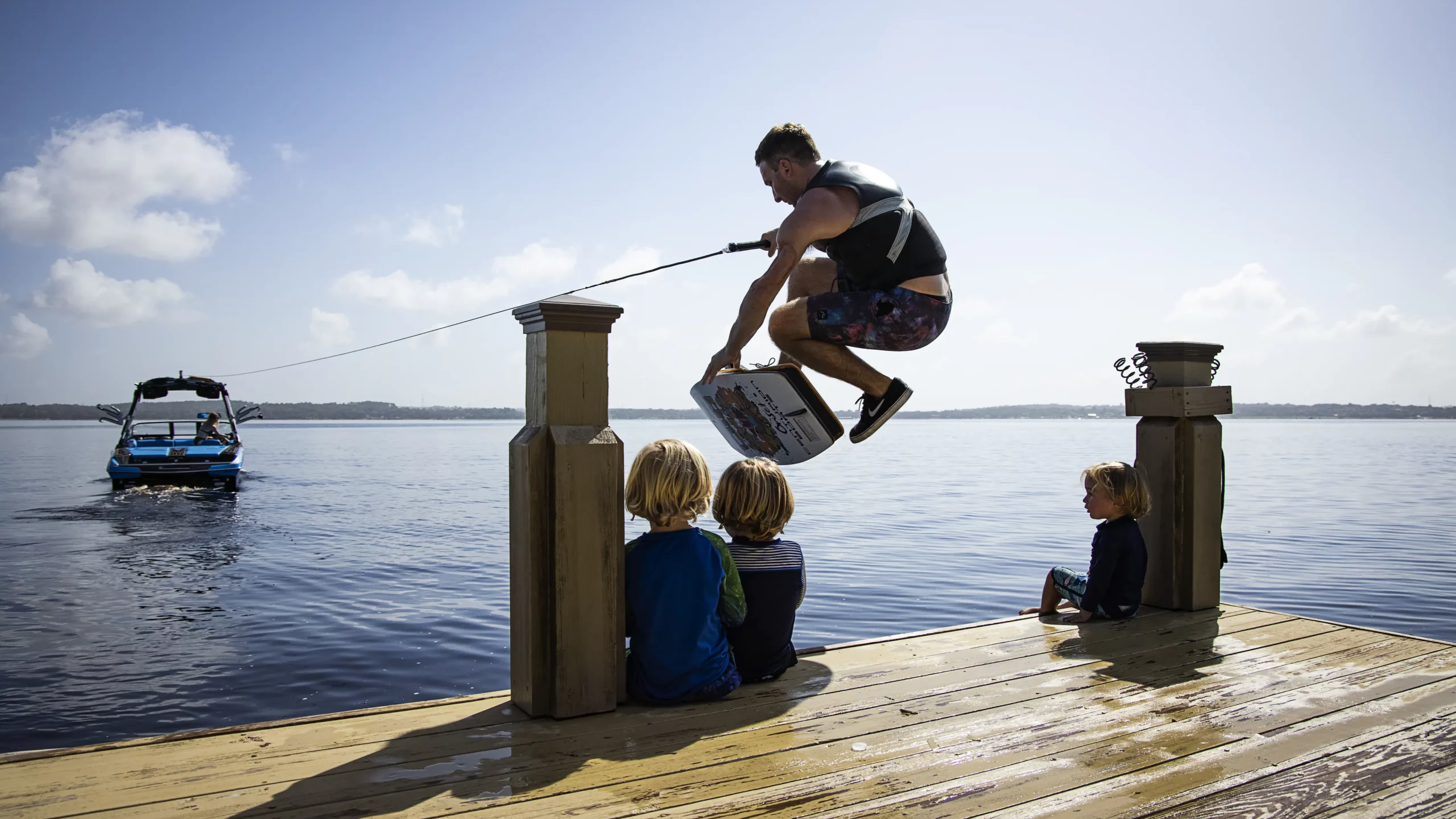 Matt Manzari jumping over children