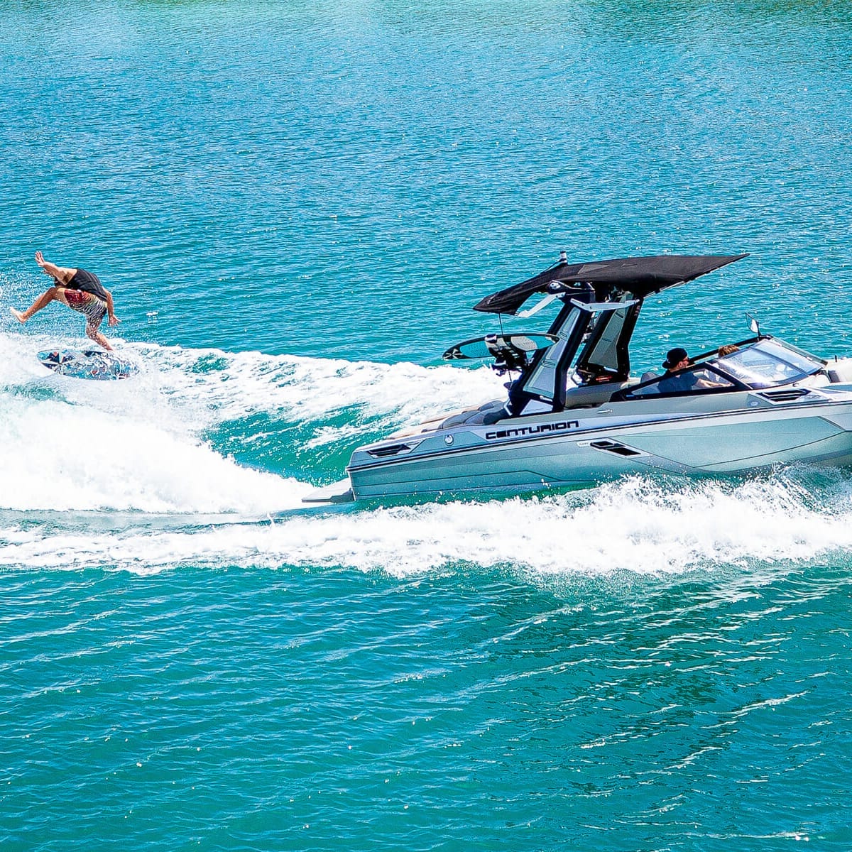 A person is wakesurfing behind a boat.