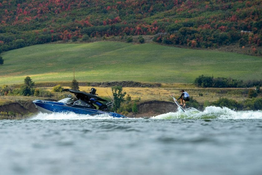 A man is riding a jet ski on a lake.