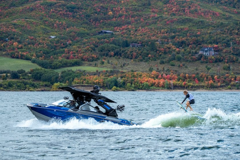 A person is riding a jet ski on a lake.