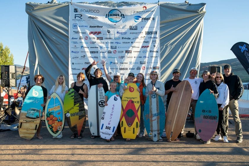 2024 WWSC Day 2 Recap: A group of people posing with surfboards