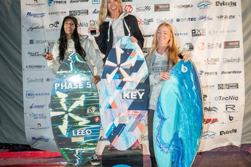 2024 WWSC Day 2 Recap: Three women posing with their surfboards.