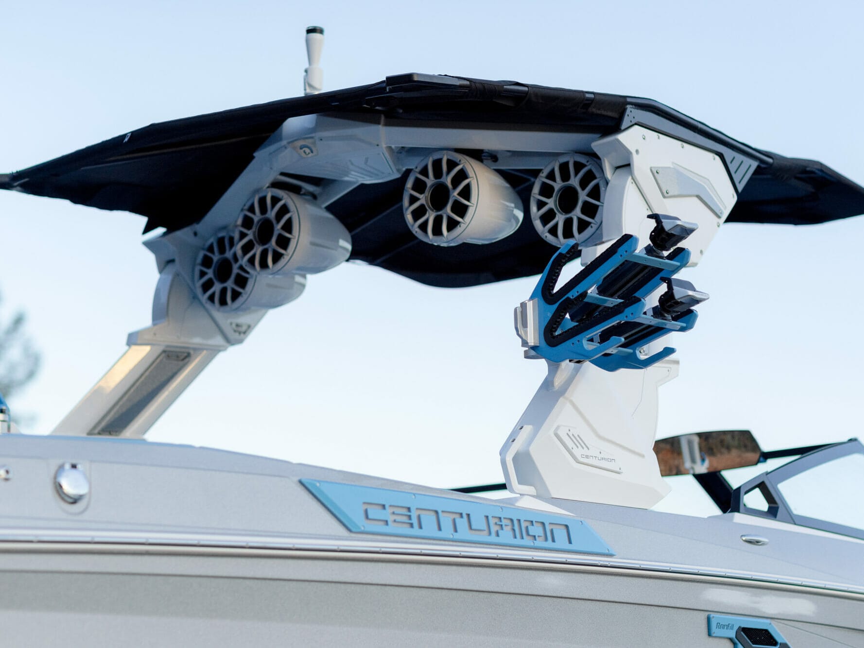 The top of a wakeboat with a speaker on it.