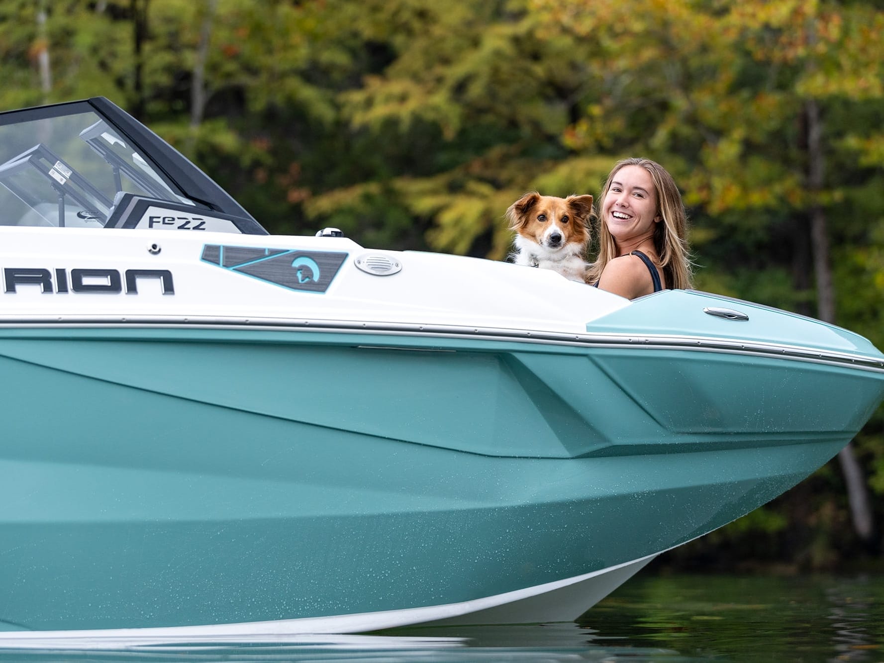 A woman, accompanied by her loyal dog, enjoys a serene moment on the back of a boat.